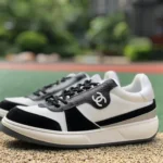 CHANEL 22 Panda Sneakers in Black and White