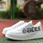 GUCCI Low-Top Canvas Platform Sneakers in White & Logo Print