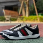 GUCCI Screener Low-Top Distressed Mesh Sneakers in Black & White