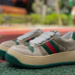 GUCCI Screener Padded Leather Cut-Out Platform Sneakers in Brown & Green