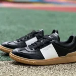 Valentino UPVILLAGE Leather Sneakers in Black & White